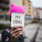 The document says women and men should be paid equally for doing an equal job